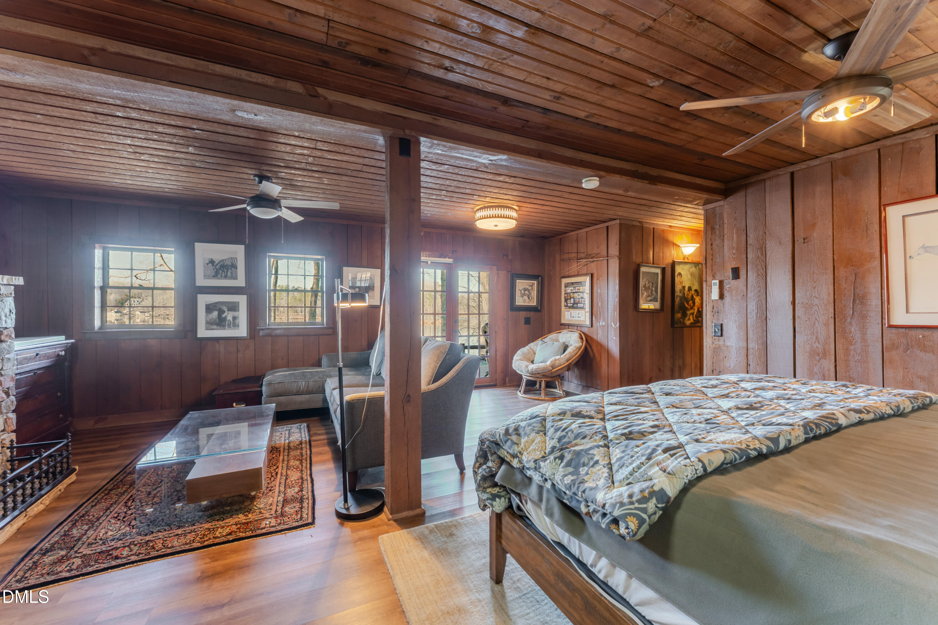 954 Huff Garrett Road Roxboro, NC 27574 - Photo 63 of 98 a bedroom with a bed and wooden floors