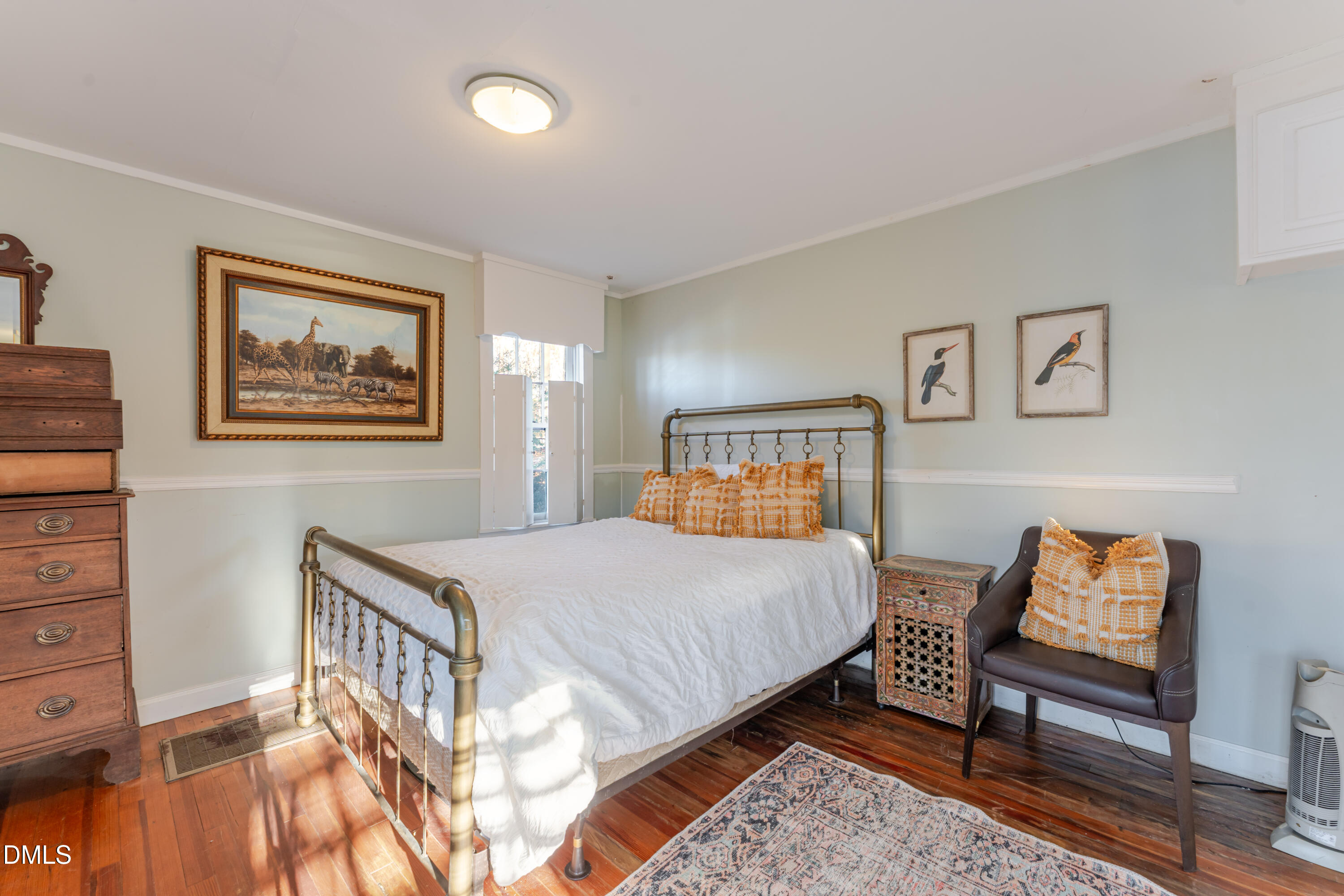 954 Huff Garrett Road Roxboro, NC 27574 - Photo 78 of 98 a bedroom with a bed and a painting on the wall