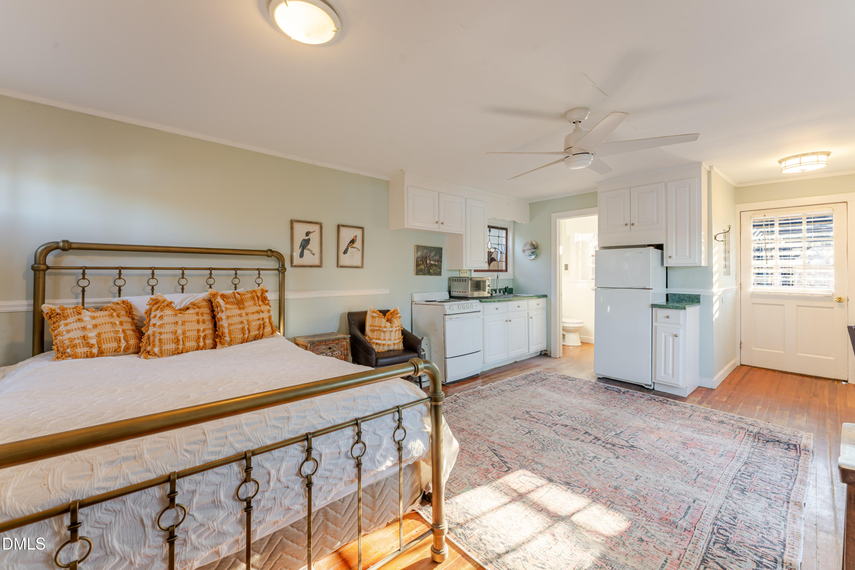 954 Huff Garrett Road Roxboro, NC 27574 - Photo 79 of 98 a bedroom with a bed and a view of kitchen