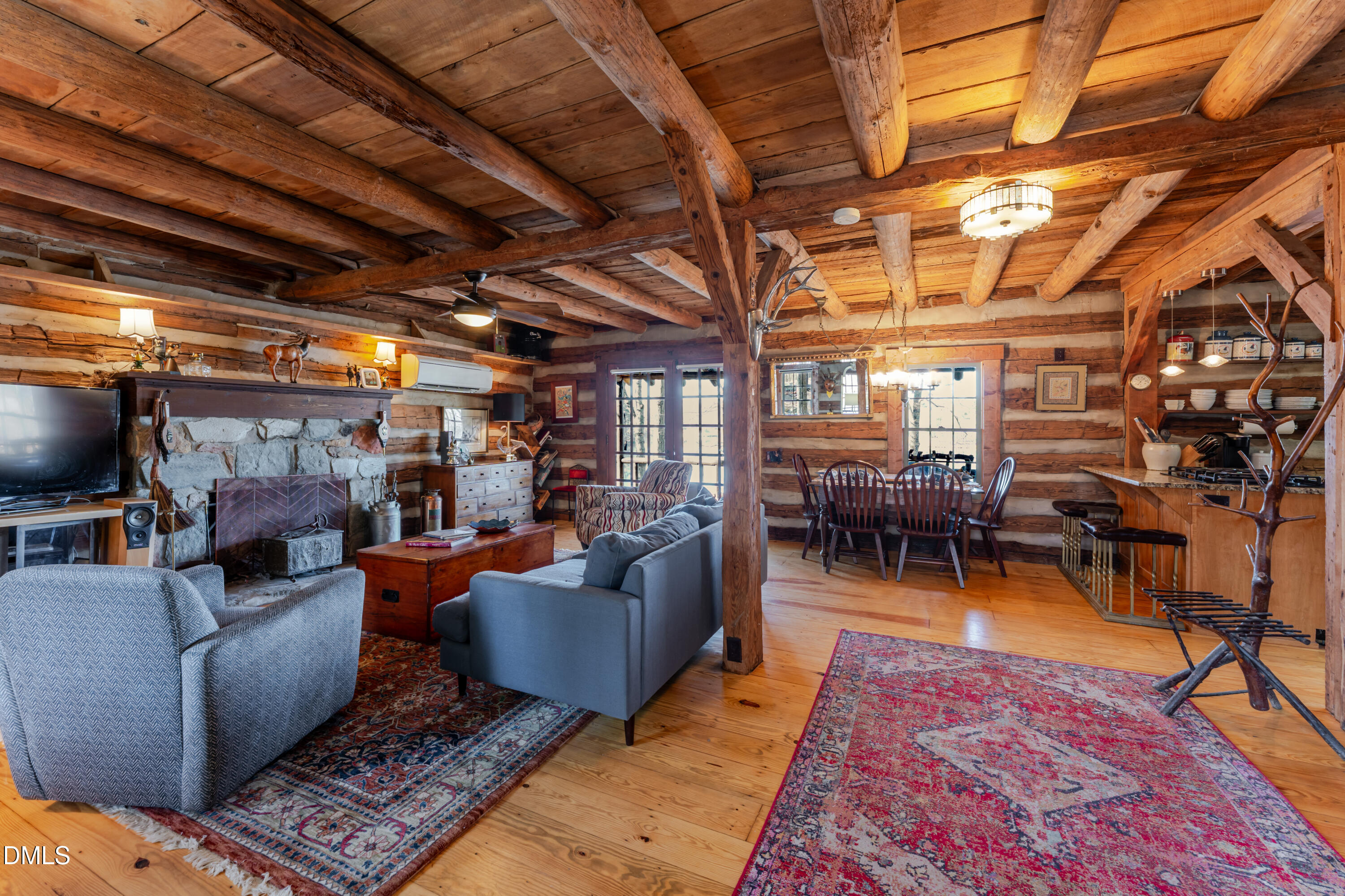 954 Huff Garrett Road Roxboro, NC 27574 - Photo 9 of 98 a living room with furniture and a chandelier
