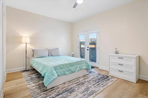 a bedroom with a bed and cabinet