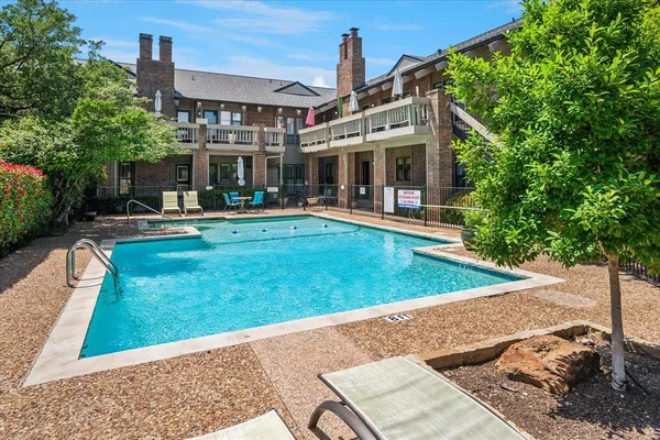 a view of a house with backyard porch and sitting area