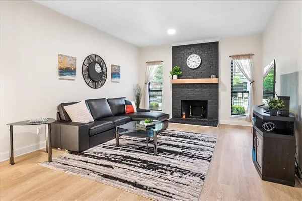a living room with furniture and a fireplace