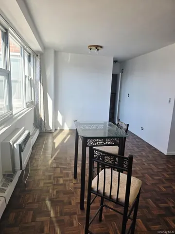 a view of a hallway with furniture