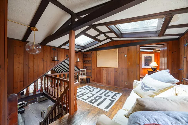 a bedroom with furniture and a window