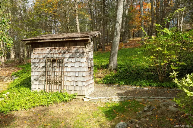 a view of a pathway of a house with a yard
