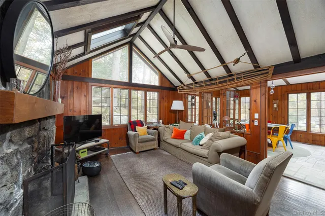 a living room with furniture or outdoor view and a large window