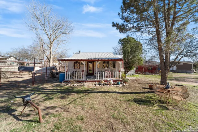 a view of a house with snow on the side of it