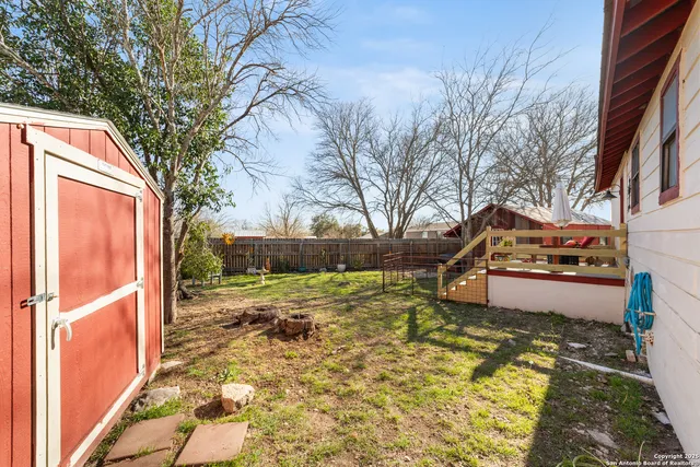 a view of a yard with an outdoor space
