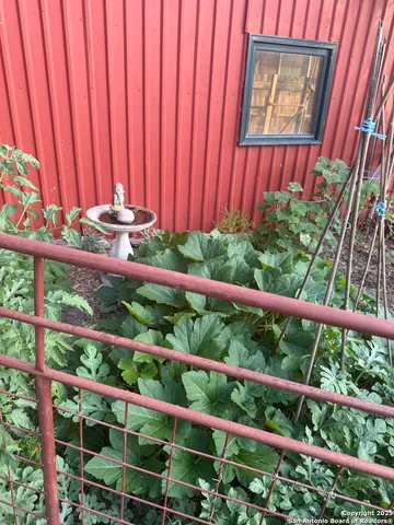 a view of a two chairs in the balcony
