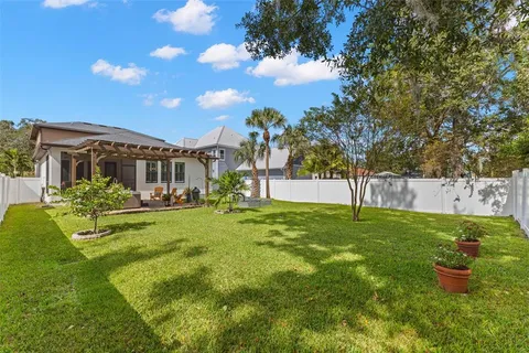 a view of a house with a backyard