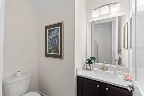 a view of a kitchen with sink dryer and cabinet
