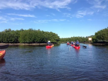 a view of a lake with a car park
