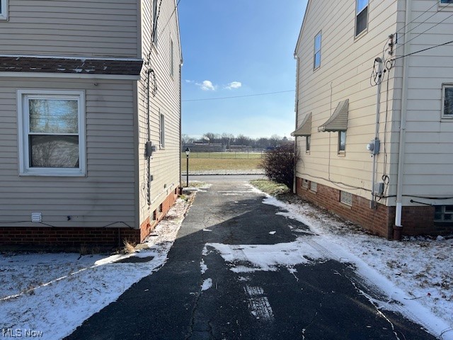13623 Thraves Road Garfield Heights, OH 44125 - Photo 4 of 23 View of snowy exterior