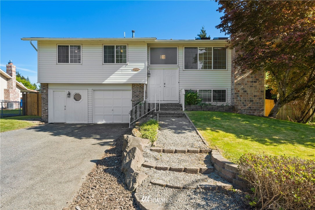 2506 170th Street Southeast Bothell, WA 98012 - Photo 1 of 27 a front view of a house with a yard