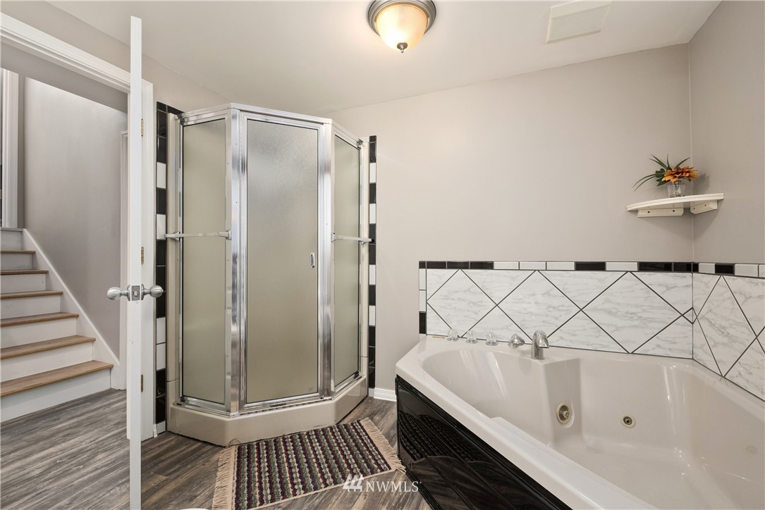 2506 170th Street Southeast Bothell, WA 98012 - Photo 18 of 27 a bathroom with a bathtub and a shower