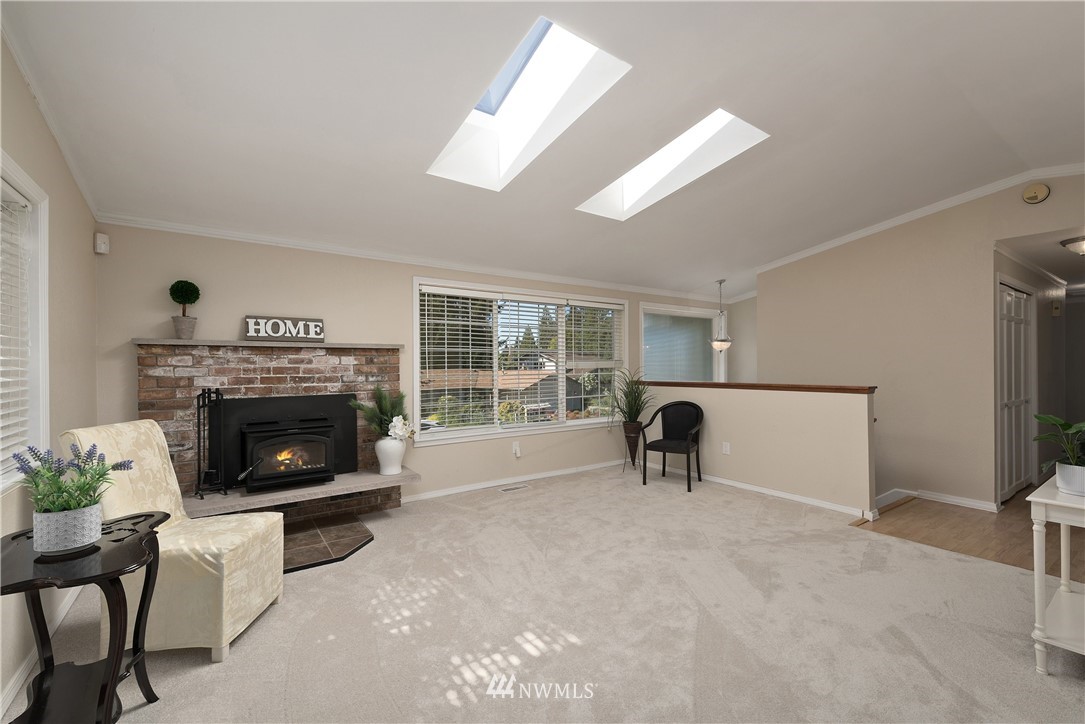 2506 170th Street Southeast Bothell, WA 98012 - Photo 3 of 27 a living room with furniture and a fireplace