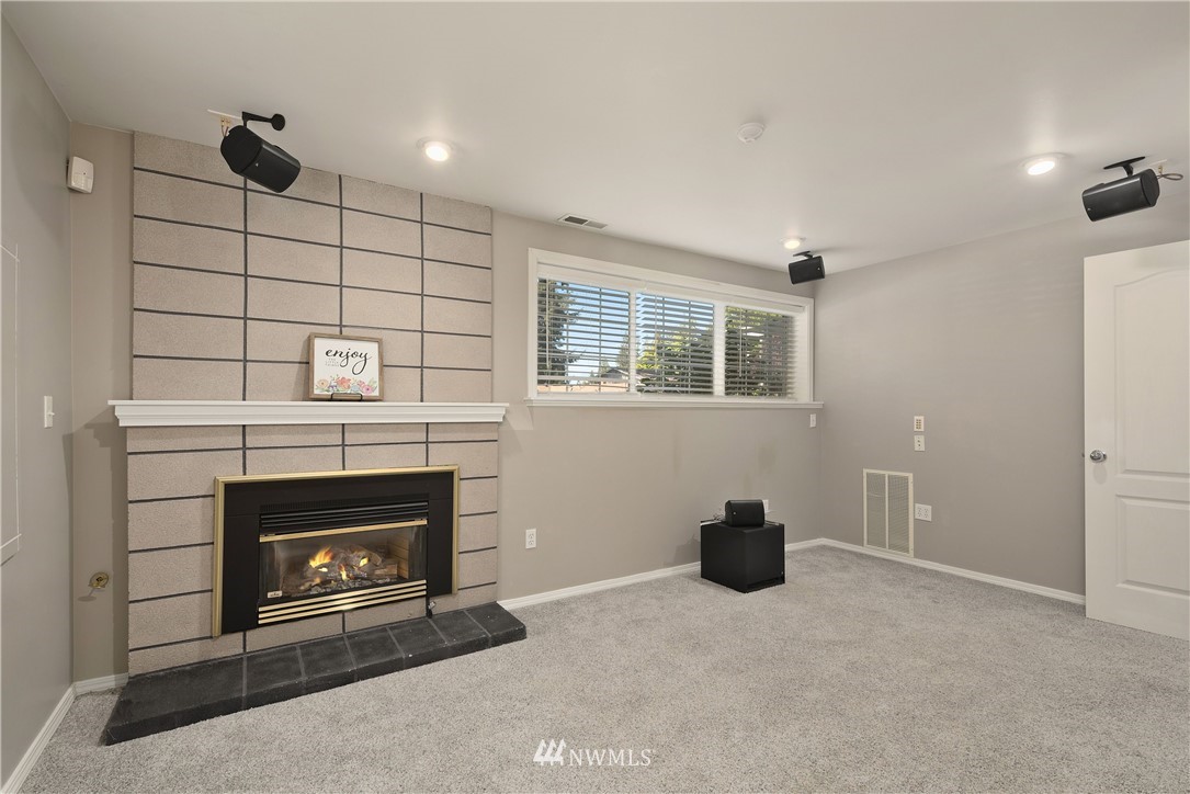 2506 170th Street Southeast Bothell, WA 98012 - Photo 22 of 27 a living room with furniture and a fireplace