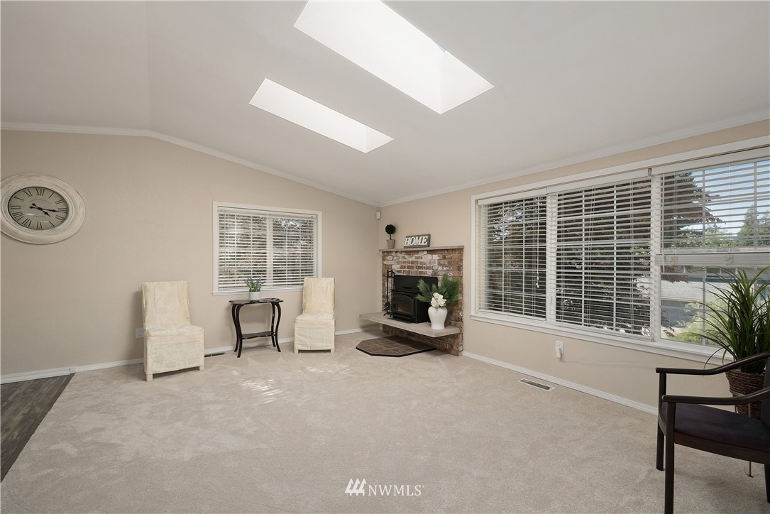 2506 170th Street Southeast Bothell, WA 98012 - Photo 4 of 27 a view of a livingroom with furniture and a window