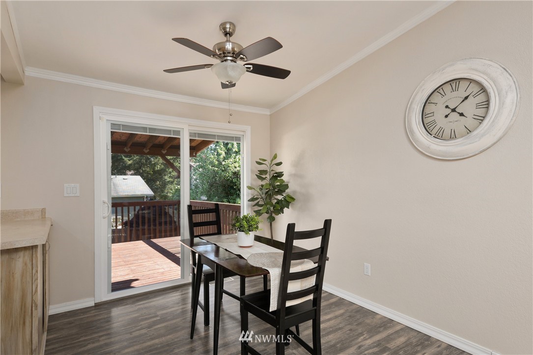 2506 170th Street Southeast Bothell, WA 98012 - Photo 6 of 27 a dining room with furniture window and wooden floor