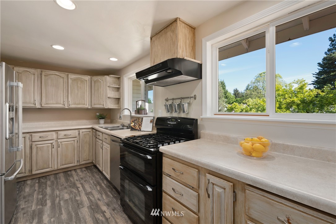 2506 170th Street Southeast Bothell, WA 98012 - Photo 8 of 27 a kitchen with a sink appliances and cabinets