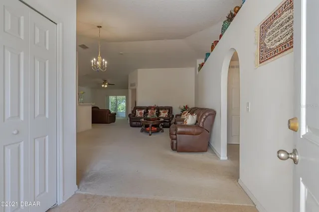 a view of livingroom with couch and window