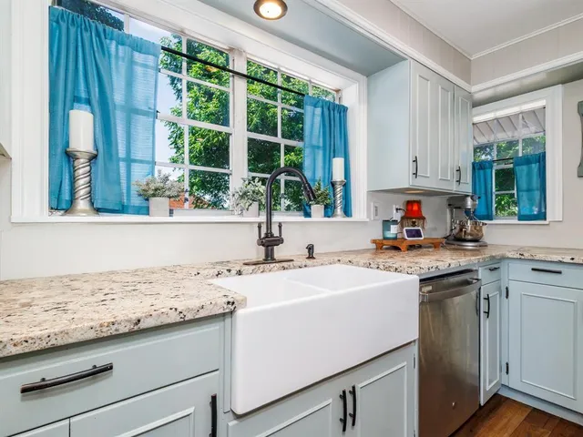 a kitchen with a sink and a window