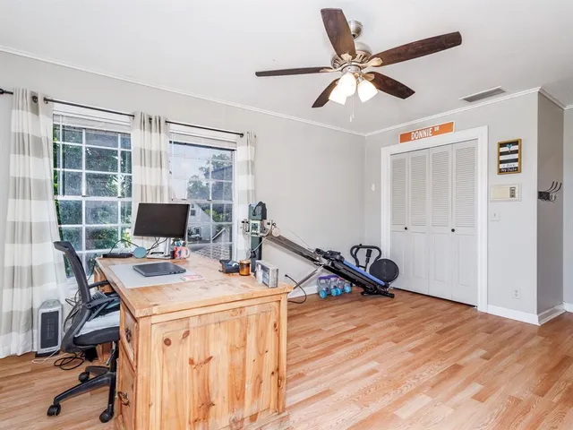 a workspace with furniture and a window