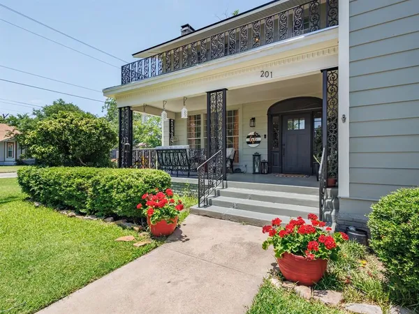 a front view of a house with a porch