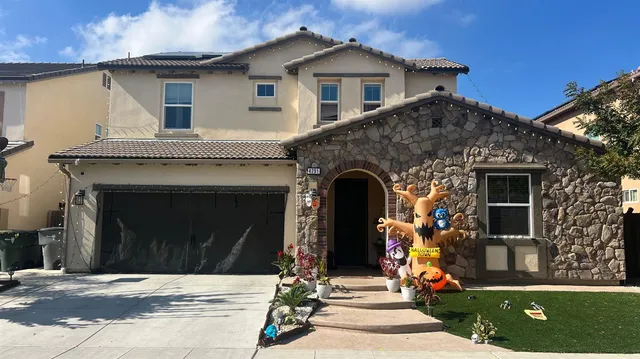 a front view of a house with a porch