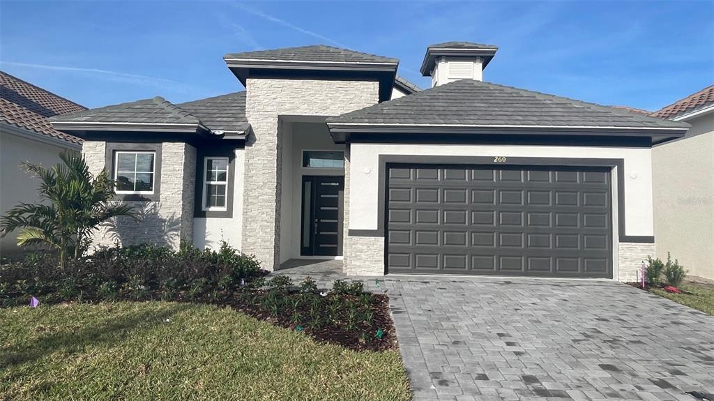 260 Hampton Loop Davenport, FL 33837 - Photo 1 of 1 a front view of a house with a yard