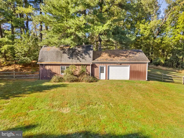 a view of a wooden door and brick wall