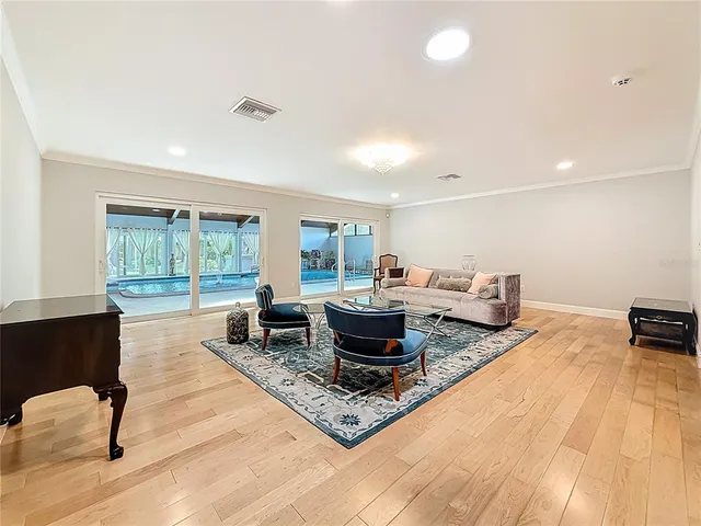 a large kitchen with stainless steel appliances wooden cabinets and a granite counter tops