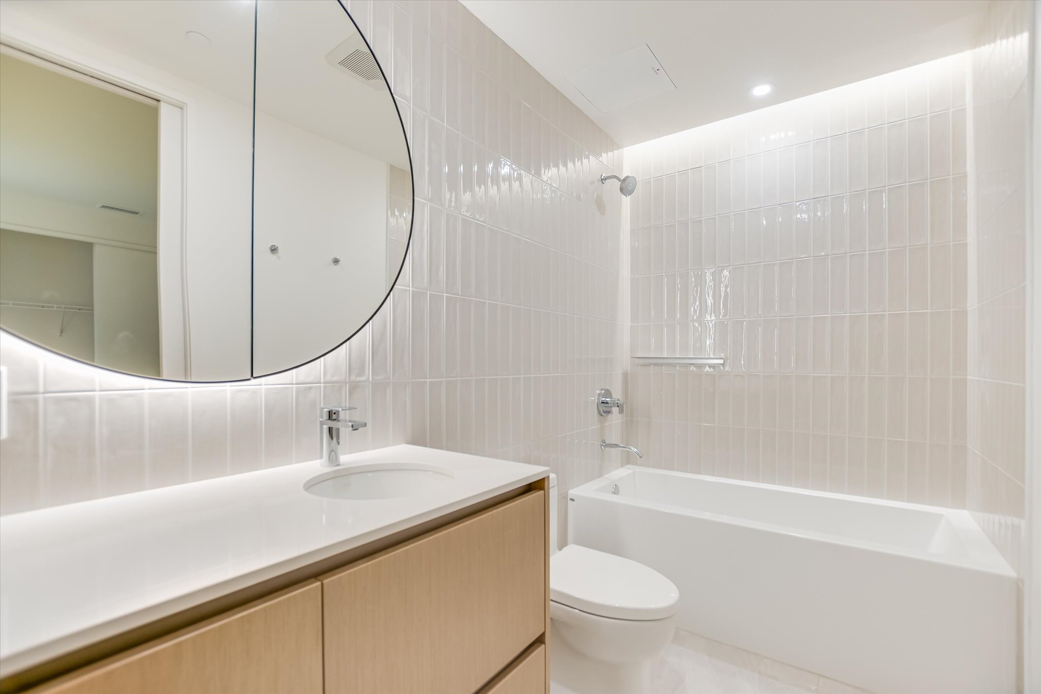 610 Davis Street, Unit 1902 Austin, TX 78701 - Photo 16 of 34 a bathroom with a sink a toilet and a mirror