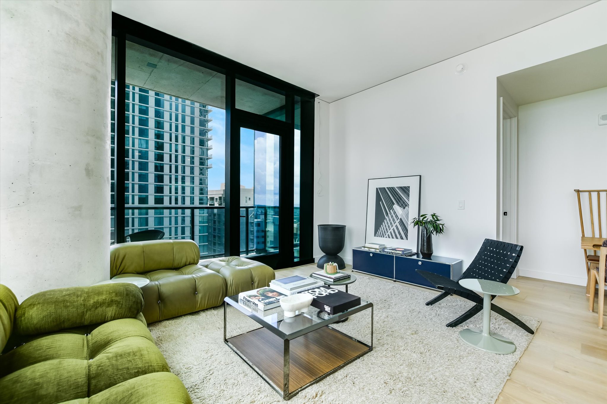 610 Davis Street, Unit 1902 Austin, TX 78701 - Photo 2 of 34 a living room with furniture and a large window