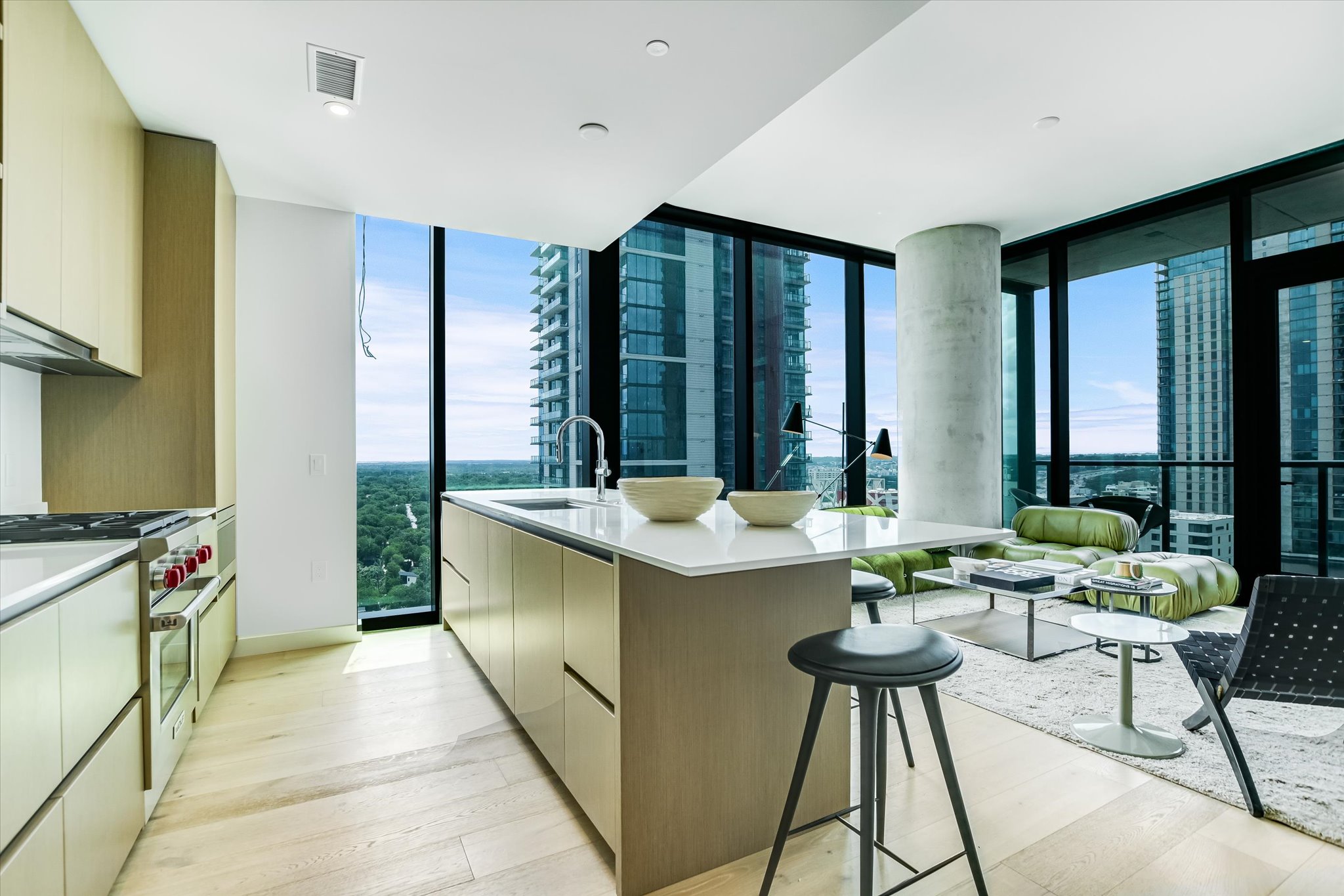 610 Davis Street, Unit 1902 Austin, TX 78701 - Photo 3 of 34 a living room with stainless steel appliances granite countertop a sink a counter top space and living room view