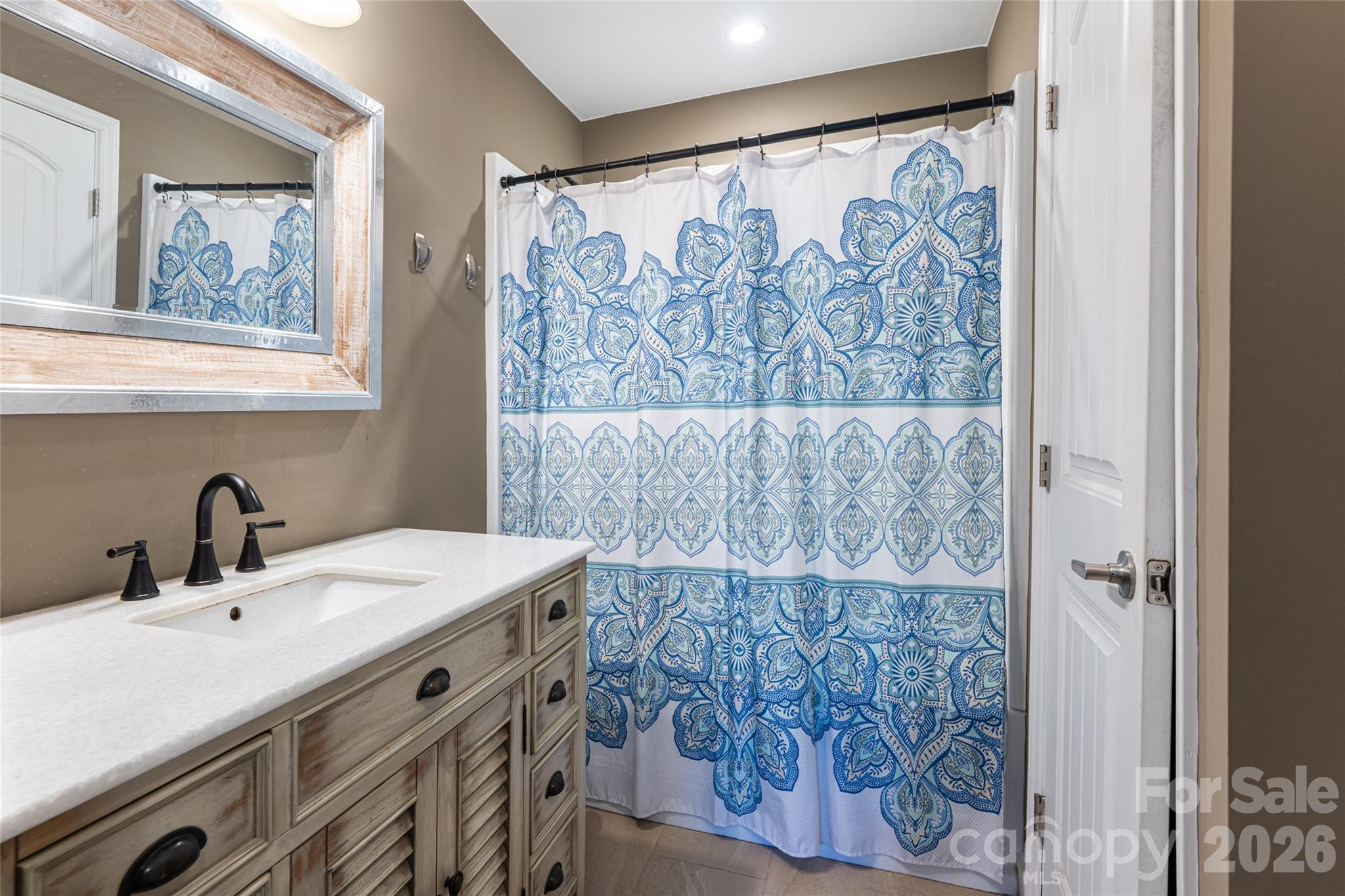 86 Rolling Hills Road Canton, NC 28716 - Photo 21 of 48 a bathroom with a sink and a mirror
