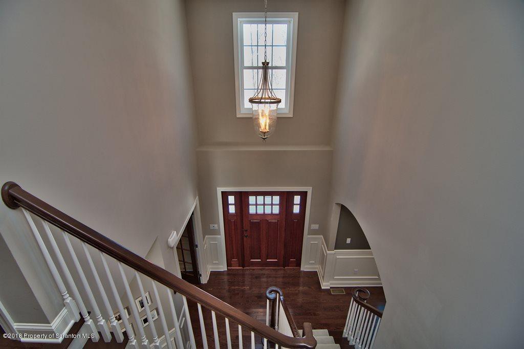 126 Highland Road Moscow, PA 18444 - Photo 47 of 77 a view of entryway and hall with wooden floor