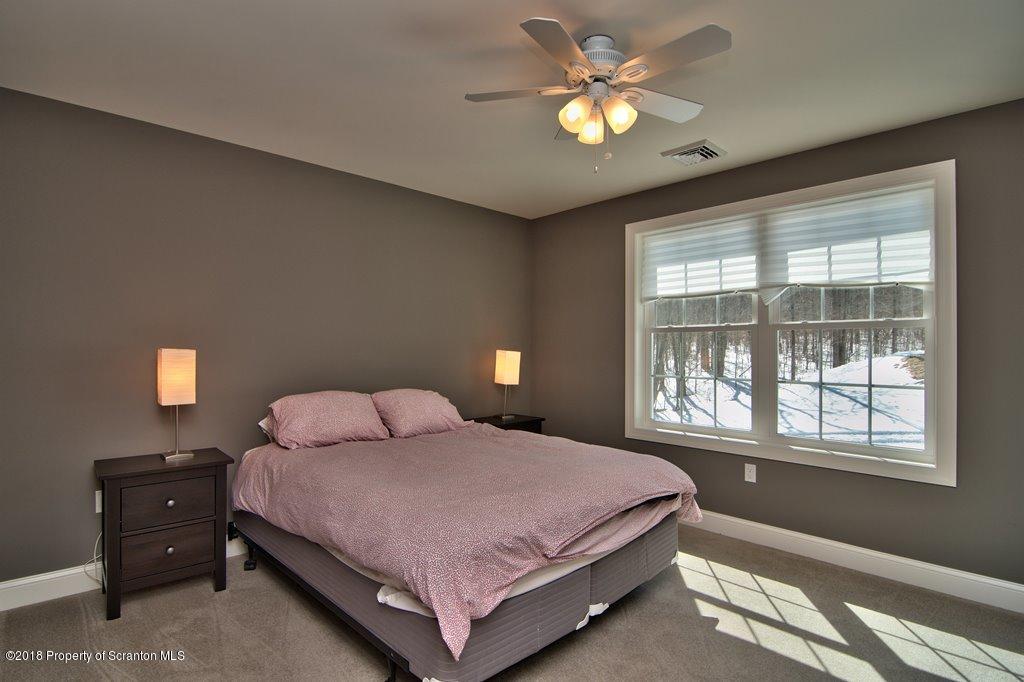126 Highland Road Moscow, PA 18444 - Photo 54 of 77 a bedroom with a bed and a window