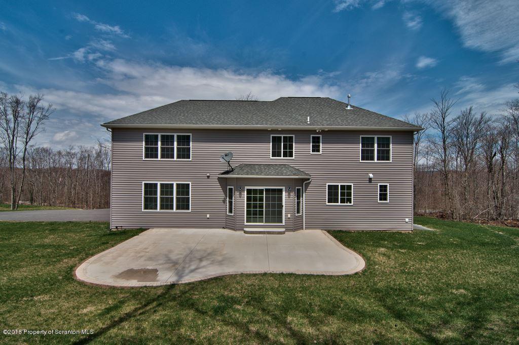 126 Highland Road Moscow, PA 18444 - Photo 6 of 77 a front view of a house with a yard