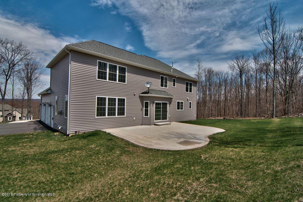 126 Highland Road Moscow, PA 18444 - Photo 7 of 77 a front view of a house with garden
