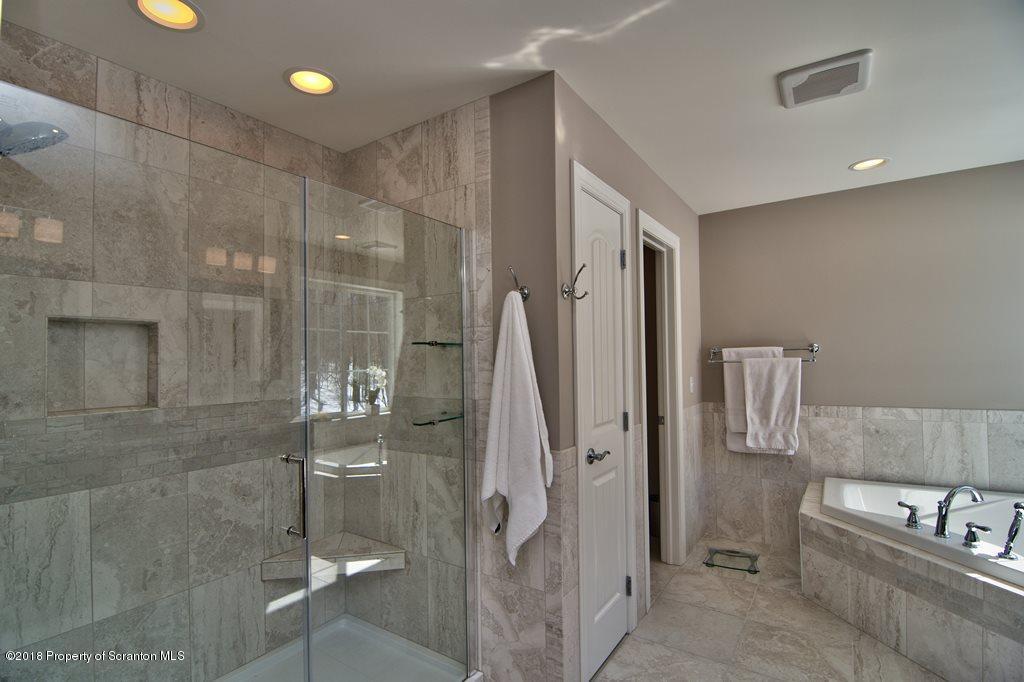126 Highland Road Moscow, PA 18444 - Photo 72 of 77 a bathroom with a glass shower door