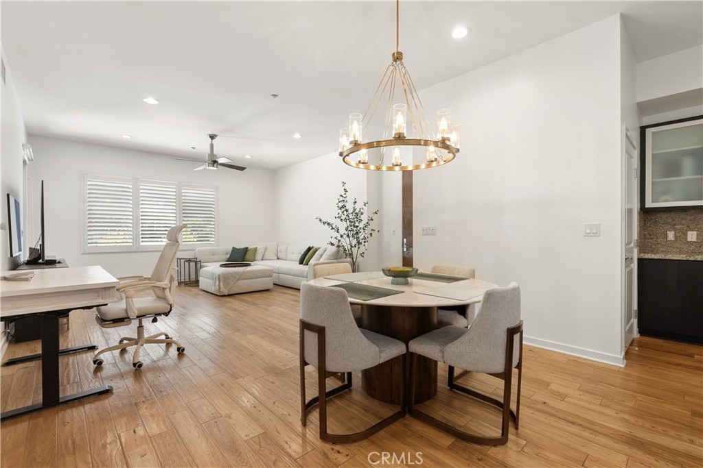 21 Gramercy, Unit 102 Irvine, CA 92612 - Photo 2 of 30 Light filled dining area with stylish lighting and an open flow throughout the main living spaces.