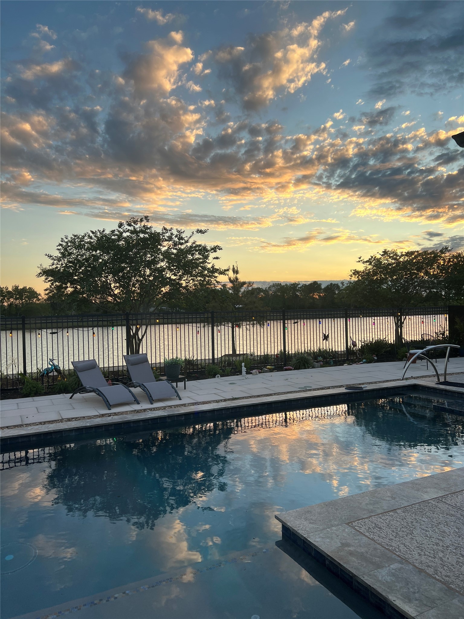 3519 Bay Drive Rosharon, TX 77583 - Photo 48 of 49 one of the beautiful sunsets we get here in Meridiana and this was actually took from my backyard , I just love the way it is reflecting in my pool
