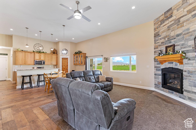 19502 South Olson Road Downey, ID 83234 - Photo 3 of 64 Living area with a fireplace, recessed lighting, a ceiling fan, and light wood-style floors