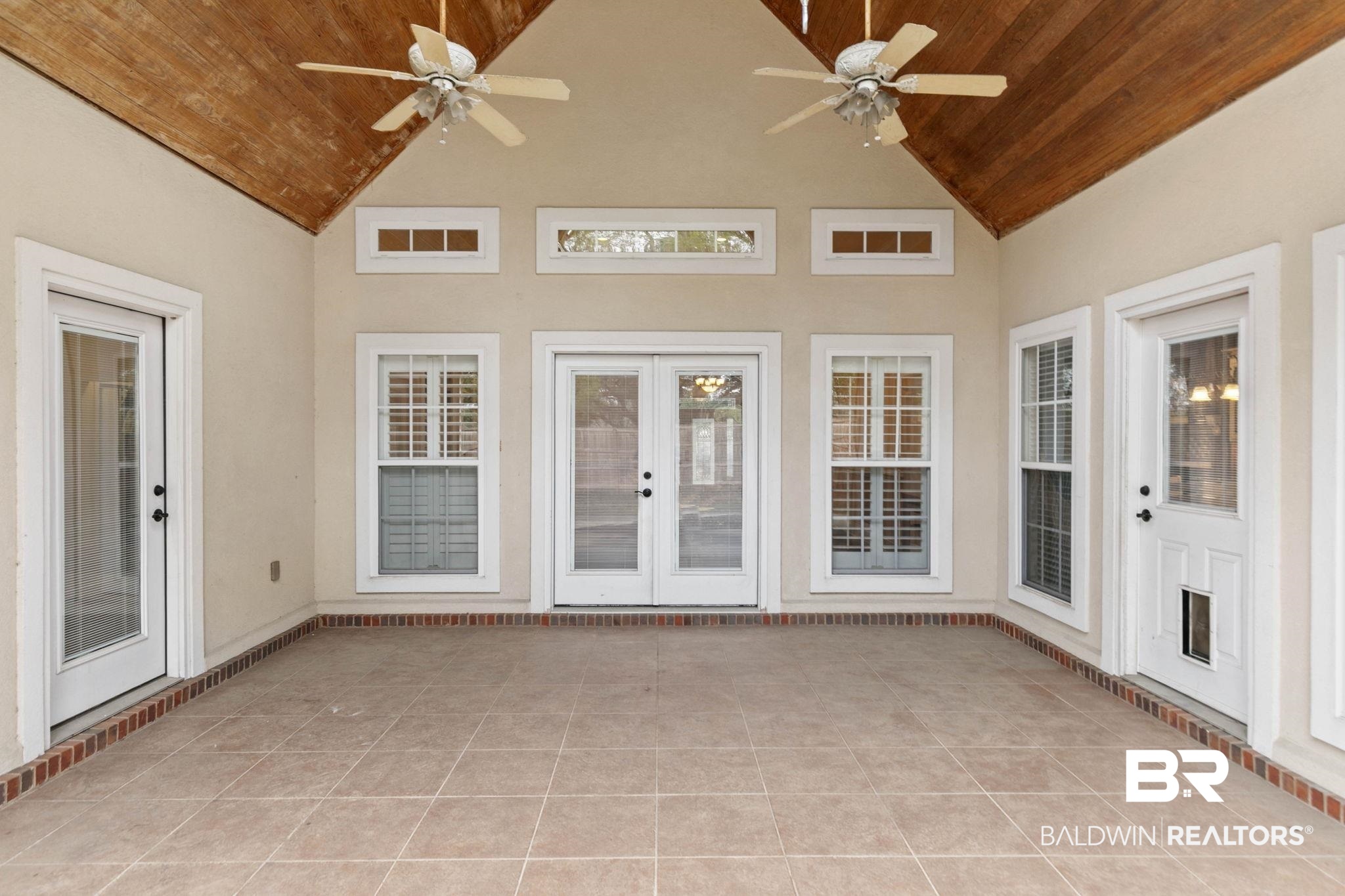 3668 Claridge Road North Mobile, AL 36608 - Photo 82 of 100 Unfurnished sunroom featuring a ceiling fan, a patio area, and french doors