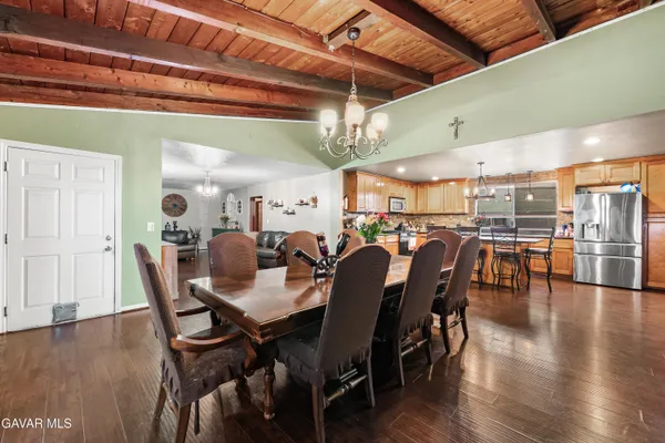 a view of a dining area with furniture and wooden floor