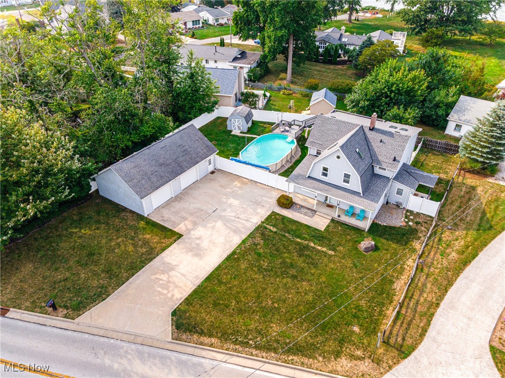 6873 Lake Road Madison, OH 44057 - Photo 4 of 29 Aerial perspective of suburban area featuring a pool area
