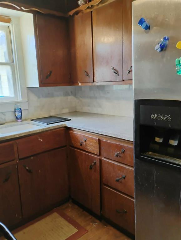 763 Frontier Street Bowie, TX 76230 - Photo 4 of 28 a kitchen with a sink and cabinets