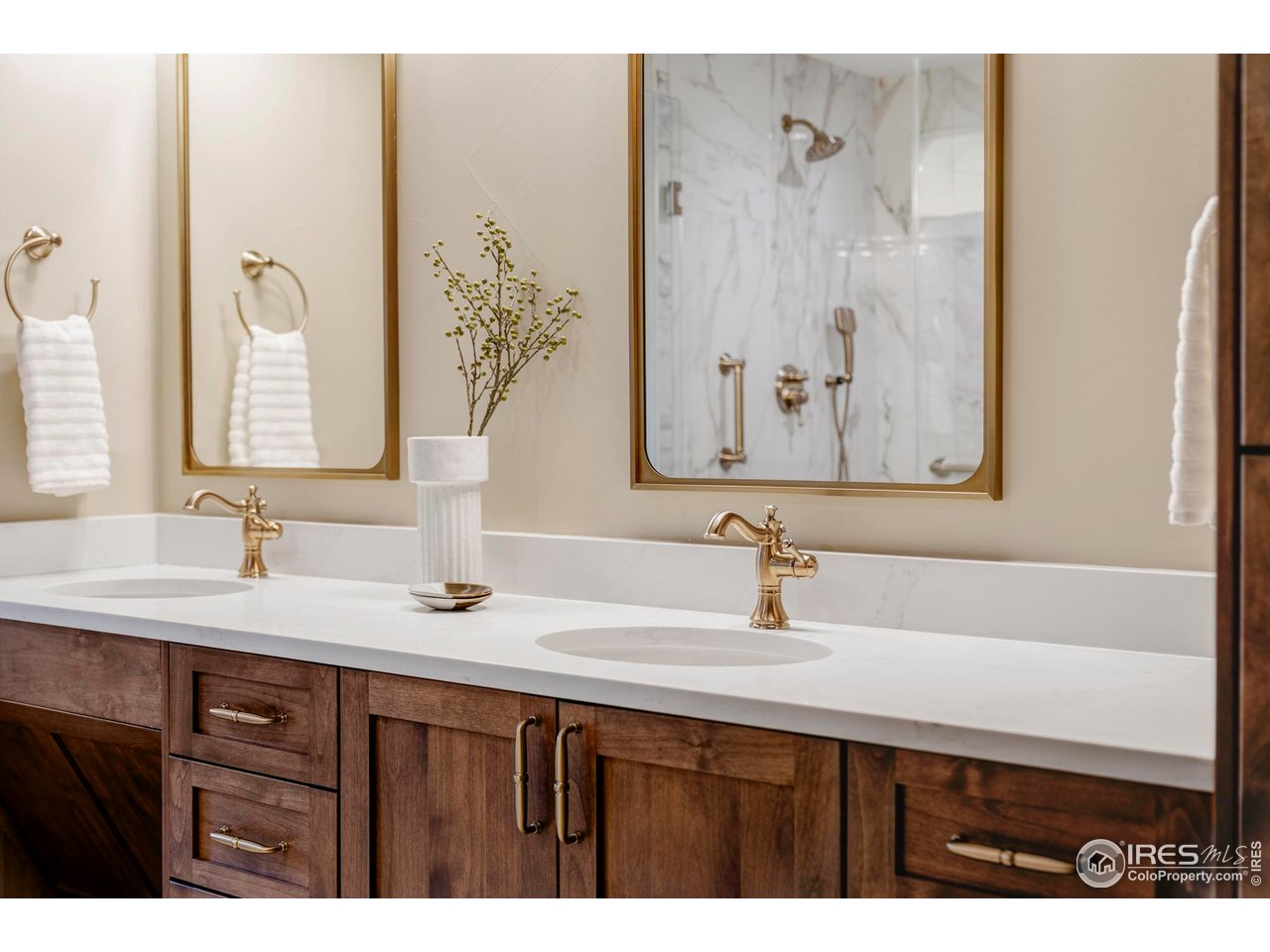 2729 South Lakeridge Trail Boulder, CO 80302 - Photo 19 of 32 Spa-inspired primary bath featuring an ADA-accessible dual vanity and zero-clearance shower.